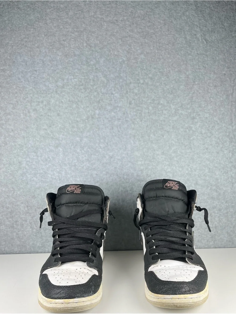 Nike Black and White High-Top Sneakers with Pink Logo
